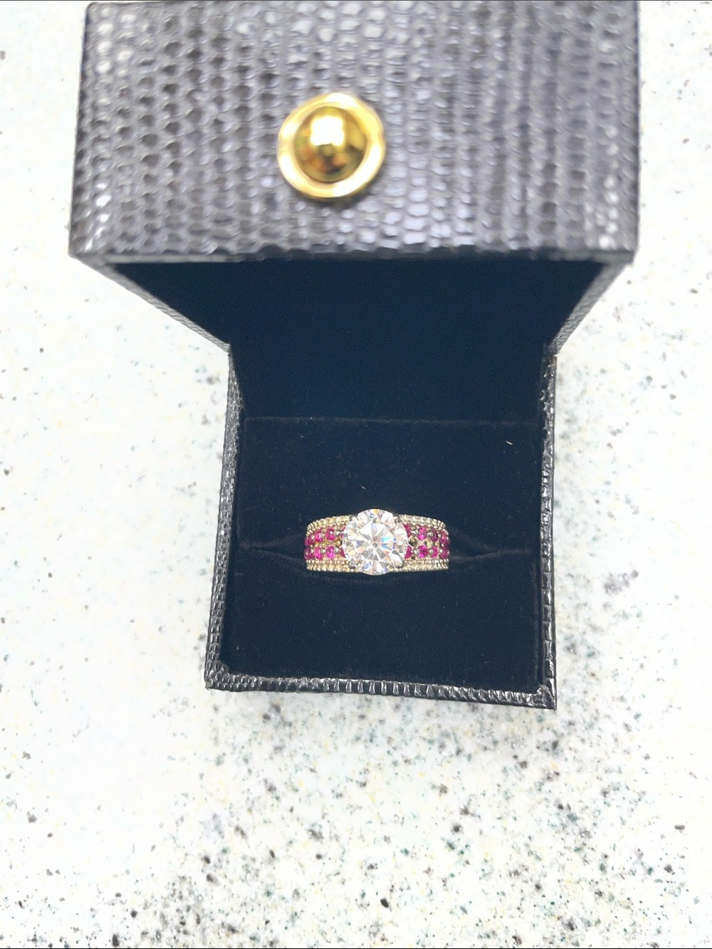 Gold-Tone Ring with Clear Center Stone and Pink Accent Stones